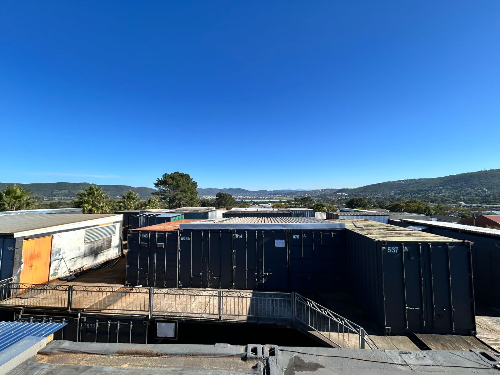 Shipping containers stacked at the Strode Containers yard on the Garden Route, Knysna